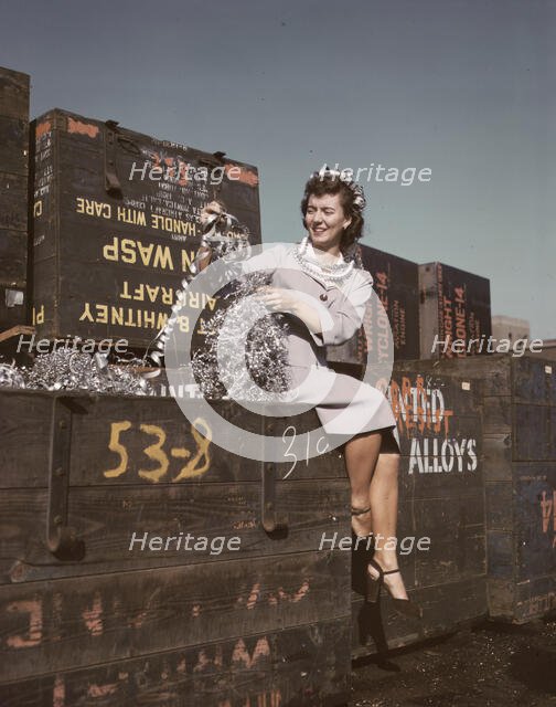 Annette del Sur publicizing salvage campaign...Douglas Aircraft Company, Long Beach, Calif., 1942. Creator: Alfred T Palmer.