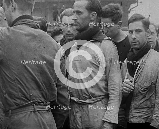 Crew of the Destroyed Bismarck Entering Captivity, 1943. Creator: British Pathe Ltd.