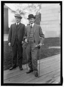 Thomas Riley Marshall (right) with unidentified man, between 1913 and 1917. Creator: Harris & Ewing.