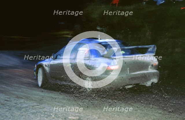 Juha Kankkunen, 1999 Subaru Impreza,  WRC Network Q Rally. Artist: Unknown.