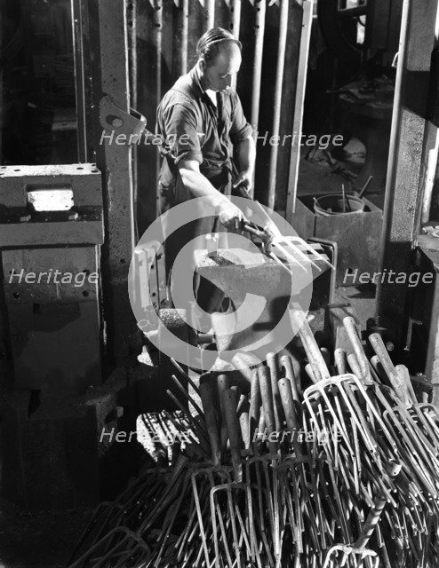 Beating hot garden forks, Ward & Payne Ltd, Sheffield, South Yorkshire, 1965. Artist: Michael Walters