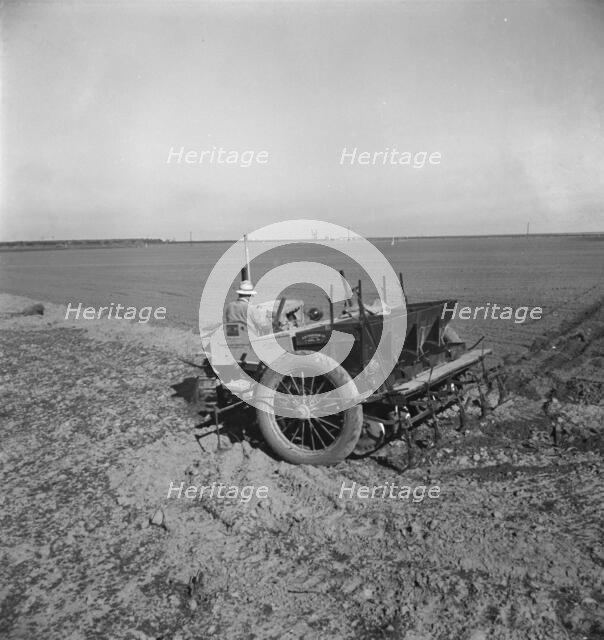 Large-scale, mechanized farming - potato planter, Kern County, California, 1939. Creator: Dorothea Lange.