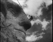 Men Working on Sculpting American President George Washington's Face at  Mount Rushmore, 1933. Creator: British Pathe Ltd.