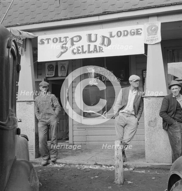 On main street of potato town during harvest season, Merrill, Oregon, 1939. Creator: Dorothea Lange.