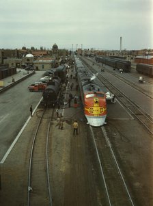 Santa Fe R.R. streamliner, the "Super Chief," being serviced..., Albuquerque, N.Mexico, 1943. Creator: Jack Delano.