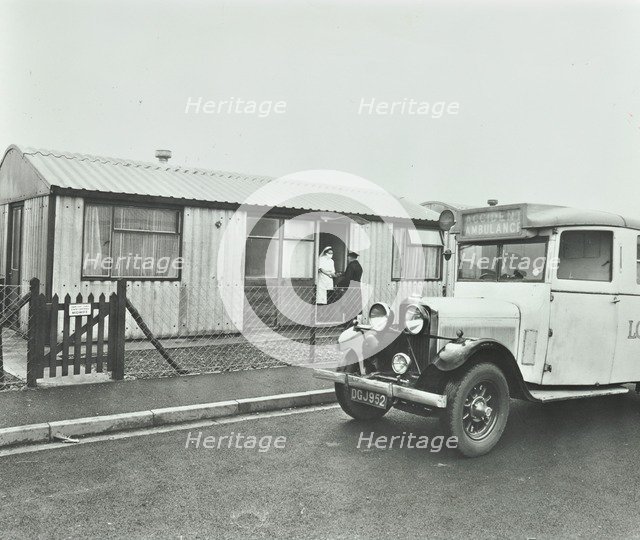 Ambulance delivering a cylinder of gas, Woolwich, London, 1946. Artist: Unknown.