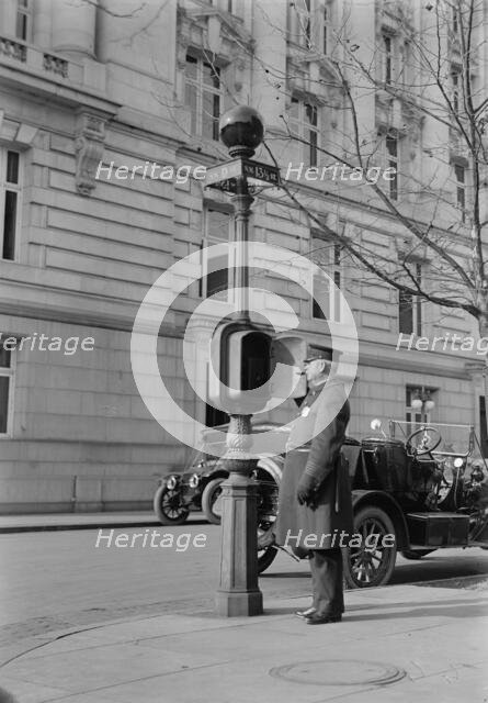 District of Columbia - Fire Alarm Box And Policeman, 1913. Creator: Harris & Ewing.