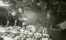 Actresses of the Moscow Art Theatre preparing presents for the Red Army, USSR, 1943. Artist: Anon
