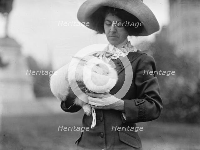 Mrs. J.R. Band with Pet Rabbit, 1911. Creator: Harris & Ewing.