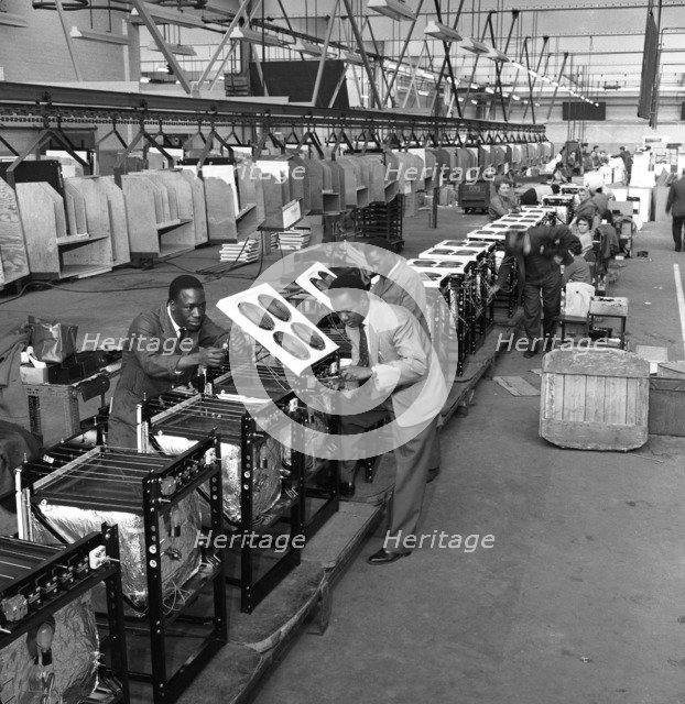 Immigrant workers on the cooker production line at the GEC, Swinton, South Yorkshire, 1962. Creator: Michael Walters.