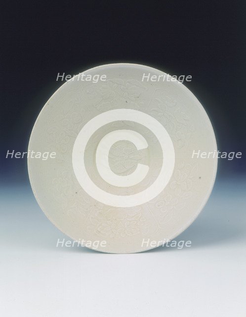 White ware bowl with moulded twin fish and floral pattern, Jin dynasty, China, 12th century. Artist: Unknown