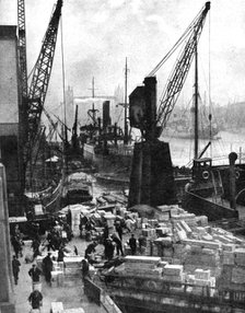 Cargo being unloaded at the docks, Upper Pool, London, 1936.Artist: Fox
