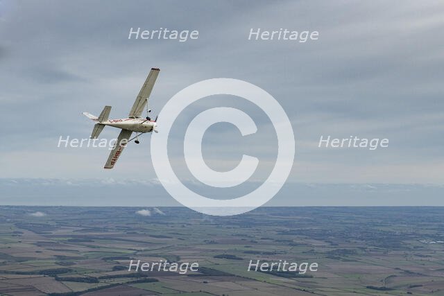 Reims-Cessna F172M Skyhawk in flight near Driffield, East Riding of Yorkshire, 2023. Creator: Chloe Pearson Jones.