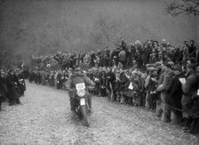 347 cc AJS of J Hey competing in the MCC Lands End Trial, Beggars Roost, Devon, 1936. Artist: Bill Brunell.