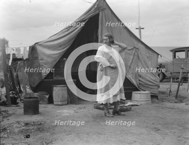 Mother of family of migrant fruit workers encamped on outskirts of Porterville, California, 1936. Creator: Dorothea Lange.