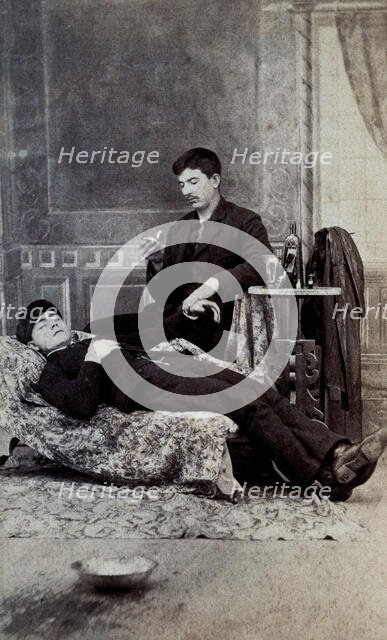 A man taking the pulse of another man, between 1800 and 1899. Creator: Unknown.
