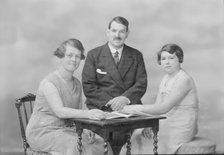 Portrait of two women and a man, c1935. Creator: Kirk & Sons of Cowes.