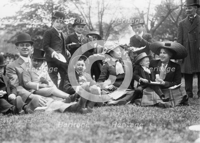 Midgets May Party - Central Park. Group seated on grass, 1910. Creator: Bain News Service.