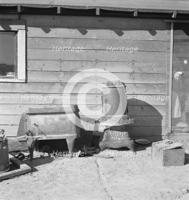 Stoves outside the Browning house being repaired for winter use, Dead Ox Flat, Oregon, 1939. Creator: Dorothea Lange.