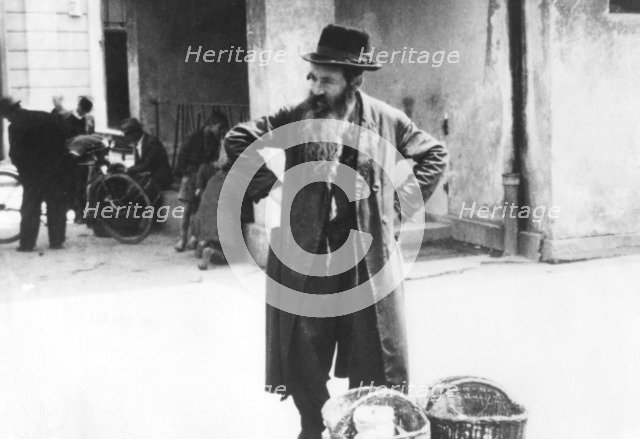 Jewish peddler selling potatoes, Warsaw Ghetto, Poland, World War II, 1940-1945. Artist: Unknown
