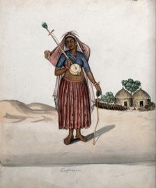 A village woman carrying a musical instrument in one hand, a stick with..., (between 1800 and 1899?) Creator: Unknown.