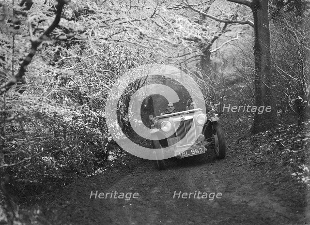 1936 MG TA of the Cream Cracker Team taking part in a motoring trial, late 1930s. Artist: Bill Brunell.