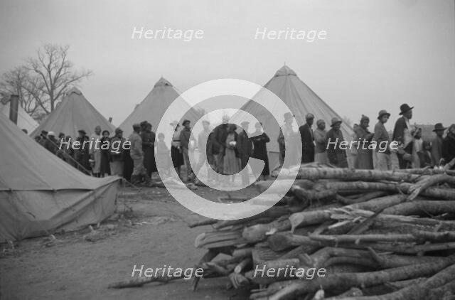 Possibly: Negroes in the lineup for food at meal time in the camp..., Forrest City, Arkansas, 1937. Creator: Walker Evans.