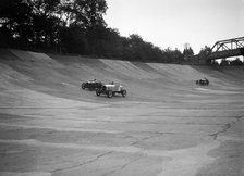 Alvis 17 and Austin 747 cc racing on the banking at Brooklands. Artist: Bill Brunell.