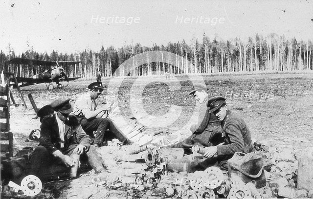 Royal Engineers Special Brigade officers and Thomas Davies’ servant assembling M bombs..., 1919. Creator: Unknown.