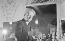 Arnold Genthe at a party, restaurant, or nightclub, between 1911 and 1942. Creator: Arnold Genthe.