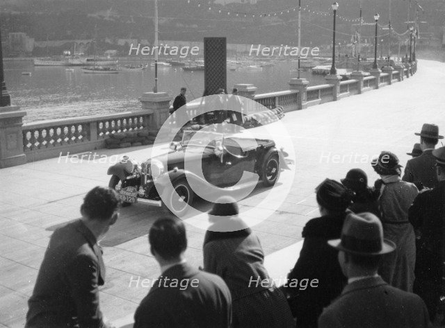 SH Light driving an SS1, at the Monte Carlo Rally, 1934. Artist: Unknown