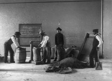 Four young men mixing fertilizers, Hampton Institute, Hampton, Va., 1899 or 1900. Creator: Frances Benjamin Johnston.