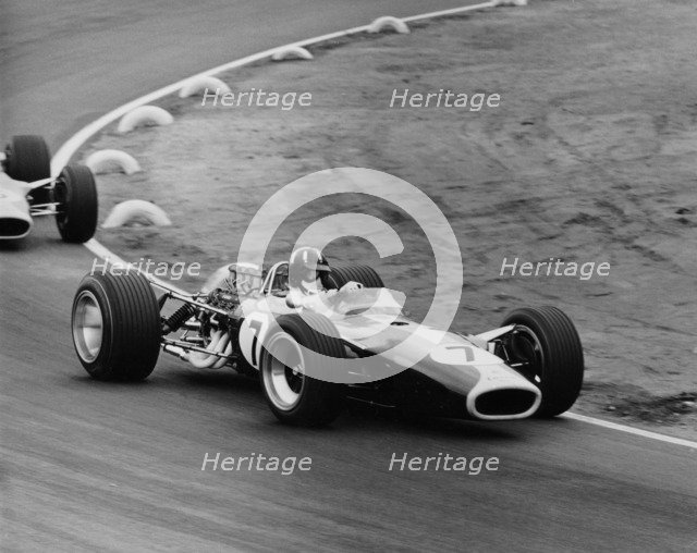 Graham Hill in a Lotus 49, French Grand Prix, Le Mans, 1967. Artist: Maxwell Boyd