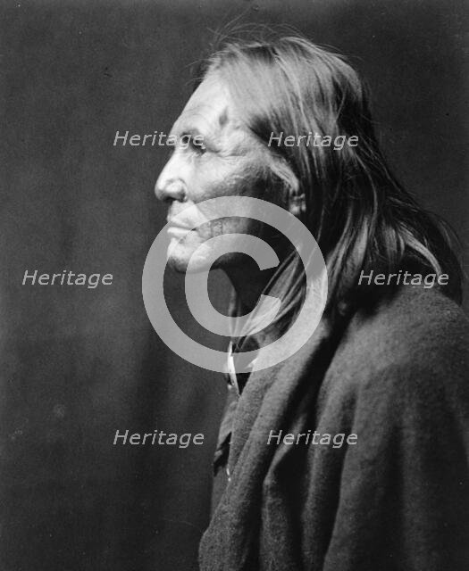 Alchise, Apache Indian, half-length portrait, left profile, c1906. Creator: Edward Sheriff Curtis.