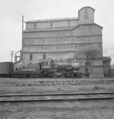 Grain elevator along railroad yard, North Platte, Nebraska, 1939. Creator: Dorothea Lange.