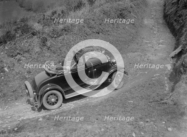 Kitty Brunell driving a 1930 2-seater Ford Model A, 1931.   Artist: Bill Brunell.