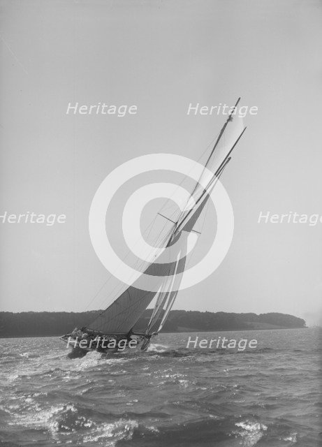 The 15 Metre cutter 'Ostara' sailing close-hauled, 1911. Creator: Kirk & Sons of Cowes.
