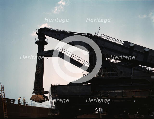 Pennsylvania R.R. ore docks, unloading iron ore from a lake freighter..., Cleveland, Ohio, 1943. Creator: Jack Delano.