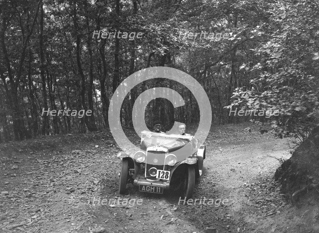 Hillman Aero Minx competing in the B&HMC Brighton-Beer Trial, Fingle Bridge Hill, Devon, 1934. Artist: Bill Brunell.
