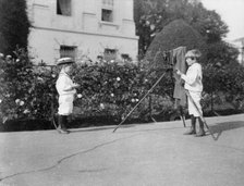 Archie Roosevelt photographing Quentin Roosevelt outdoors, 1902. Creator: Frances Benjamin Johnston.