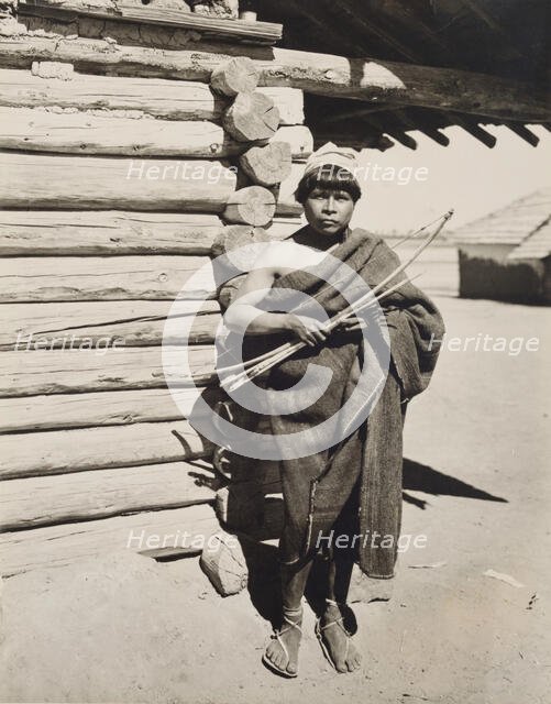 Untitled (man holding bow and arrow, New Mexico), c.between 1920 and 1940. Creator: Guillermo Bravo.