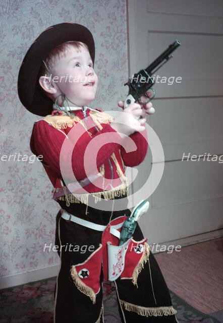 Young boy in a cowboy outfit, c1955.  Creator: Arthur Charles Kirby Ware.