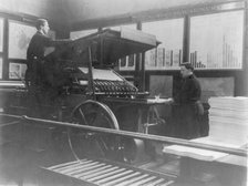 2 men operating map printing press at U.S. Geol. Survey, (1900?). Creator: Frances Benjamin Johnston.