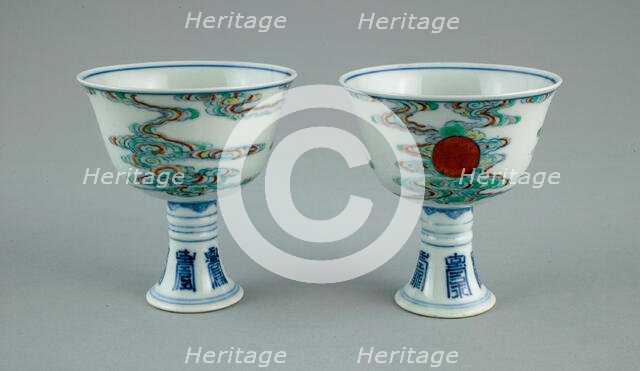 Pair of Stem Cups with Sun amid Clouds and Stylized Characters for 'Long Life' (Shou), Qing dynasty. Creator: Unknown.