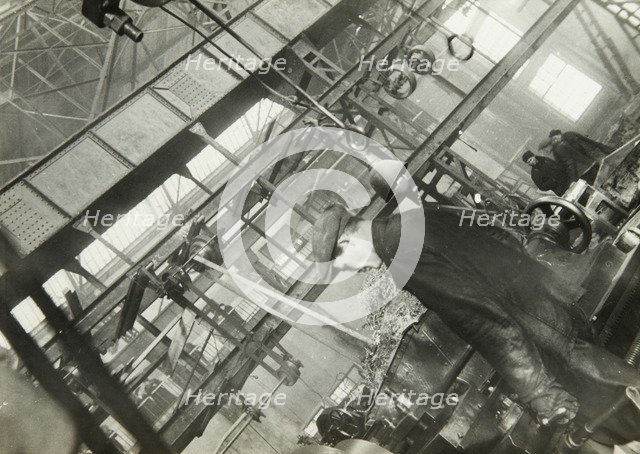 In a mechanical engineering factory, USSR, 1930s. Artist: Unknown