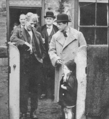 The Prince of Wales visiting a miner's cottage in the Northeast of England, 1929 (1936). Artist: Unknown.