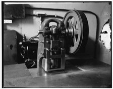Stamping machine at Treasury, between 1910 and 1920. Creator: Harris & Ewing.