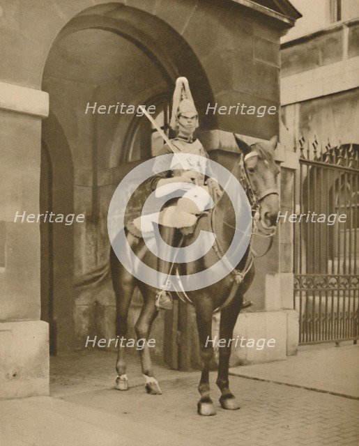 'A Living Statue in Whitehall: The Lifeguards' Sentry', c1935. Creator: Unknown.
