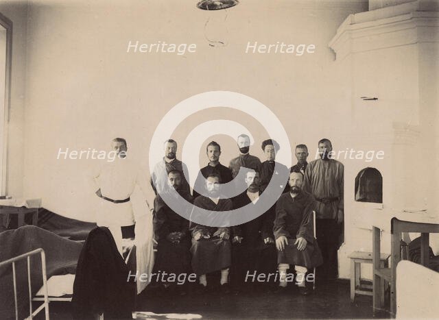 A group of people being treated in a hospital room, 1900. Creators: I. A. Podgorbunskii, V. I. Podgorbunskii.