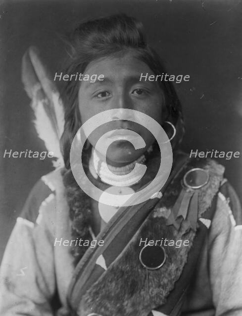 Kashhila-Wishham. Male Chinookan Indian, head-and-shoulders portrait, facing front..., c1910. Creator: Edward Sheriff Curtis.